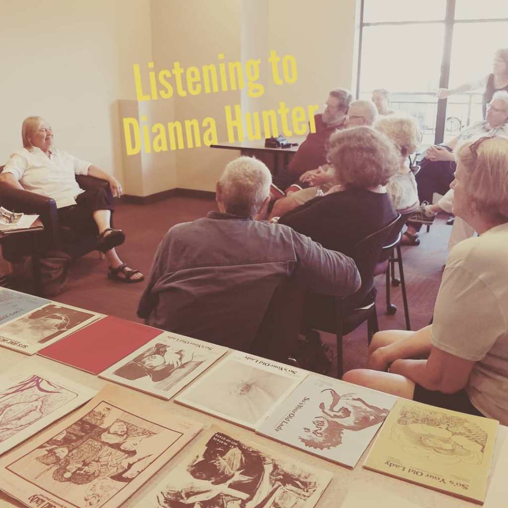 dianna hunter in front of gathering of listeners